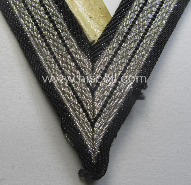 SS (ie. 'Allgemeine o. Waffen-SS') arm-insignia being an 'SS', so-called: 'Ehrenwinkel für Altgediente Kämpfer o. Angehörigen der SS' (or: honorary-chevron for old campaigners) still retaining its period 'RzM'-etiket