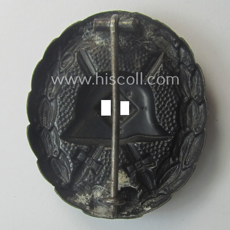 Attractive, early-pattern black-class wound-badge (ie.: 'Verwundeten Abzeichen in Schwarz') being a detailed so-called: 'Spanish Civil-War'-version that comes in a just moderately used- and/or worn, condition