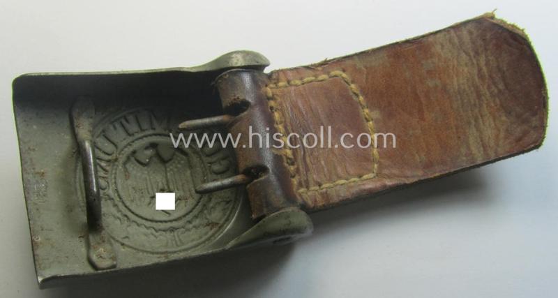 Minimally used, WH (Heeres) field-grey-coloured- and/or steel-based belt-buckle being a clearly maker-marked example that comes mounted onto its maker- (ie. 'Schmöle & Comp - Menden'-) marked and/or '1941'-dated leather-based tab