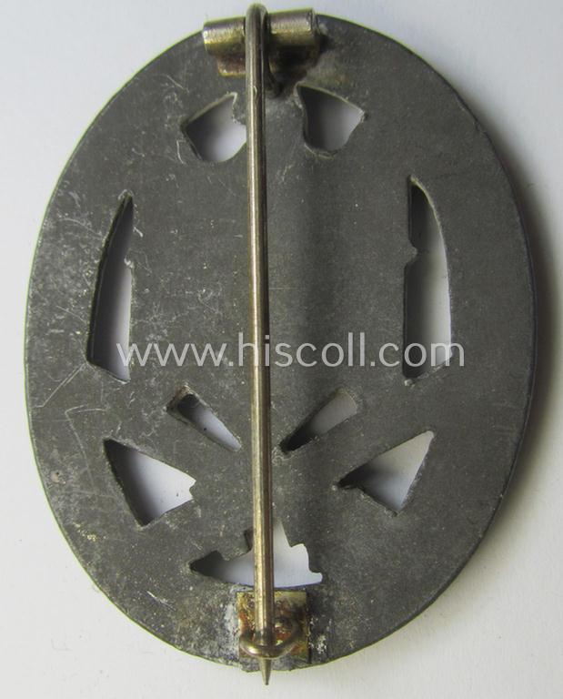 'Allgemeines Sturmabzeichen' (or: General Assault Badge ie. GAB) being a typical unmarked, zinc-based- (ie. 'Feinzink'-) and/or: 'flat-back'-version as was (I deem) produced by the: 'Rudolf Karneth'-company