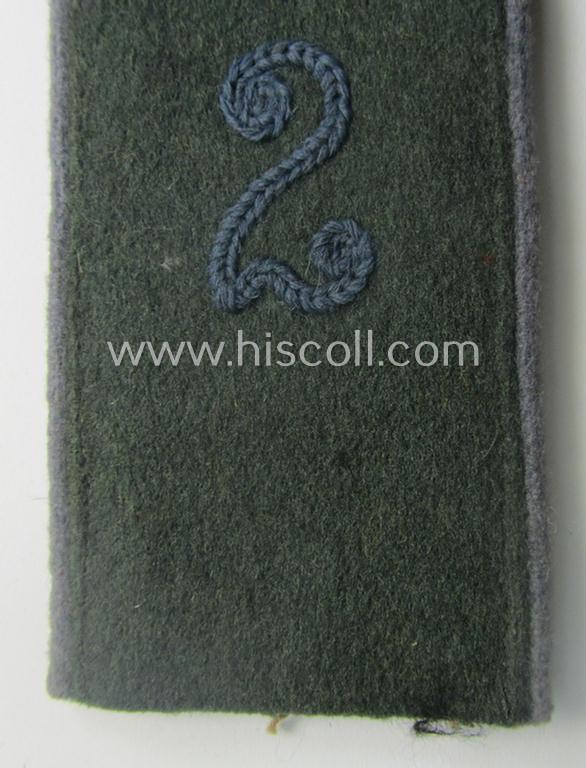 Single, WH (Heeres) EM-type 'cyphered' (M40-pattern) shoulderstrap: 'Soldat des Nachschub-Abtlgs. 2'