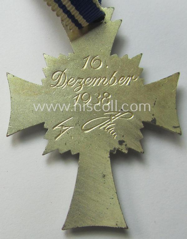 'Ehrenkreuz der deutschen Mutter - zweite Stufe' (or: silver-class mothers'-cross) that came mounted onto its long-sized ribbon and that came stored in its period pouch by the (unusual!) maker: 'Werner Redo - Saarlautern'