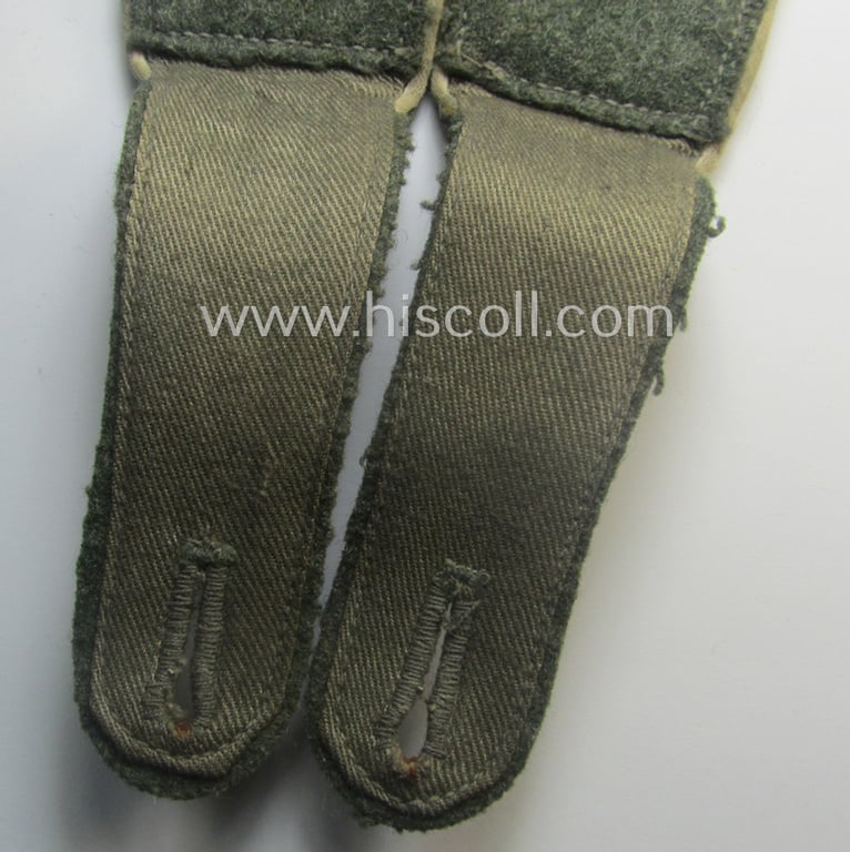 Moderately used pair of WH (Heeres), early- (ie. mid-) war-period- (ie. 'M41- o. M43'-) pattern EM-type shoulderstraps as piped in the white-coloured branchcolour as was intended for a: 'Soldat eines Infanterie-Rgts.'