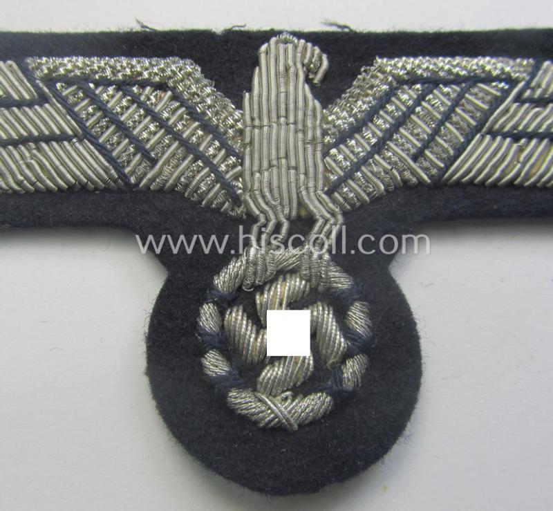 WH (Kriegsmarine) neatly hand-embroidered, officers'-type breasteagle on a darker-blue background as was specifically intended for the various naval administrative-officials (ie. 'Beambten der Kriegsmarine')