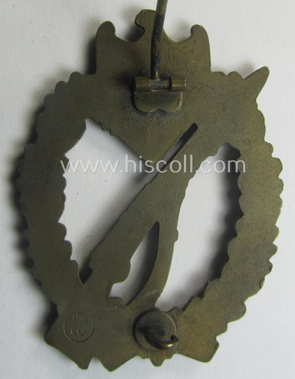 'Infanterie Sturmabzeichen in Bronze' (or: bronze-class infantry assault-badge ie. IAB) being a maker- (ie. 'ÜÜ'- ie. 'E.F. Wiedmann') marked so-called: 'Lily Pad-hinge'-example as was executed in zinc-based metal