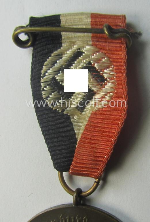 Darker-bronze-toned commemorative-medal (ie. 'Erinnerungs-Medaille') entitled: 'Hindenburg - Hitler - 30.1.1933 - 5.3.1933' and that comes mounted onto its period ribbon showing an interwoven swastika-device