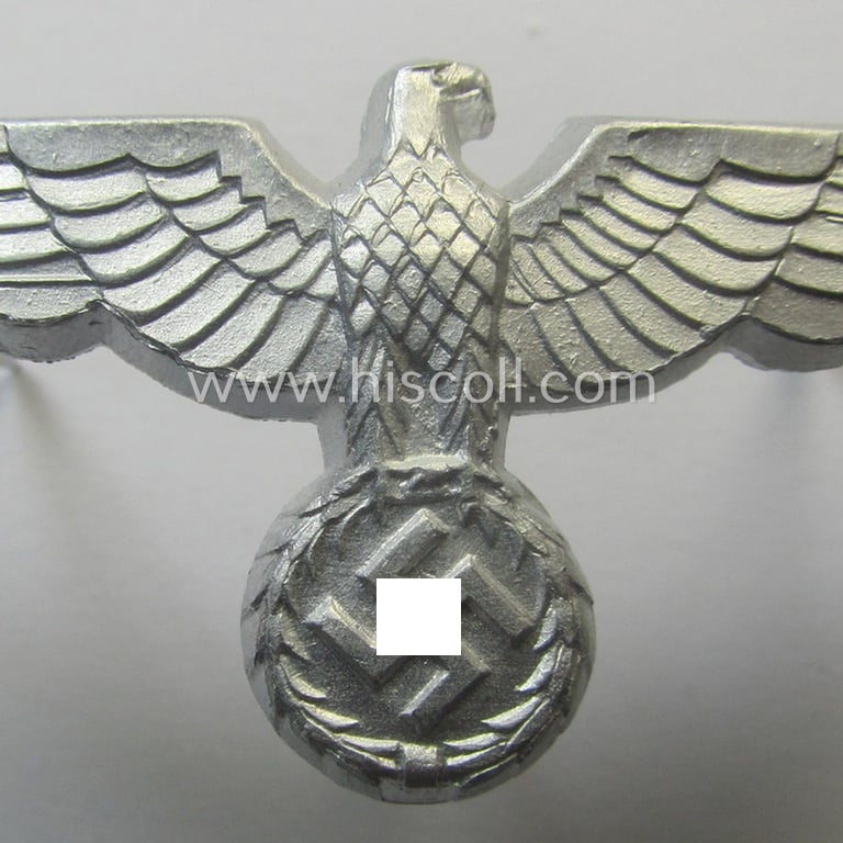 Superb, WH (Heeres) bright-silver-toned (ie. aluminium-based), EM- (ie. NCO- or officers') type visor-cap-eagle being a clearly maker- (ie. 'F.L.L.'-) marked and/or '38'-dated example that comes in a 'virtually mint- ie. unissued'-, condition