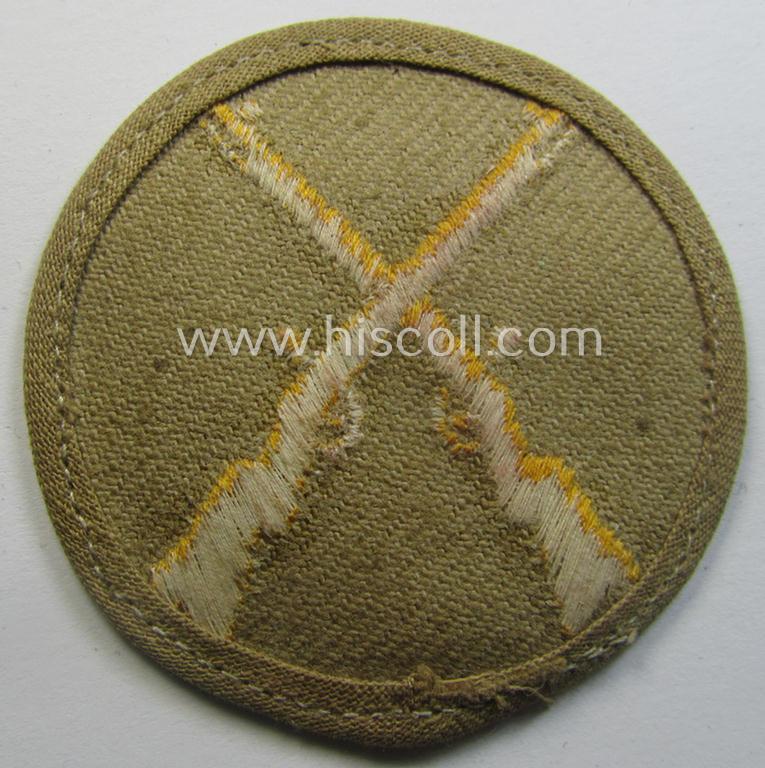 WH (Heeres) 'tropical'-issue, trade- and/or special-career insignia (ie. machine-embroidered 'Laufbahn- o. Tätigkeitsabzeichen') as was intended for an army: 'Waffenmeister' (or weapon-equipment NCO)