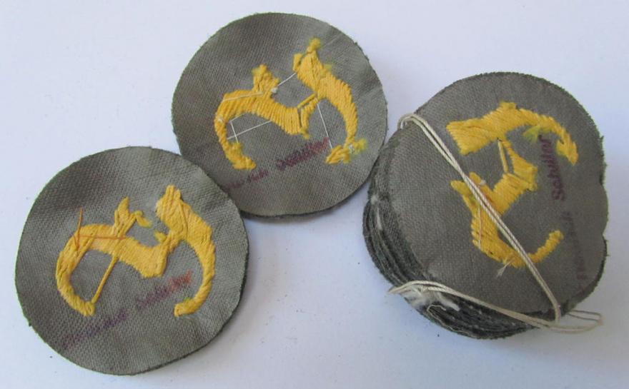 Attractive, WH (Heeres) so-called: trade- and/or special career arm-insignia, as was intended for a: army: 'Feuerwerker', being a neatly hand-embroidered variant on field-grey-coloured wool