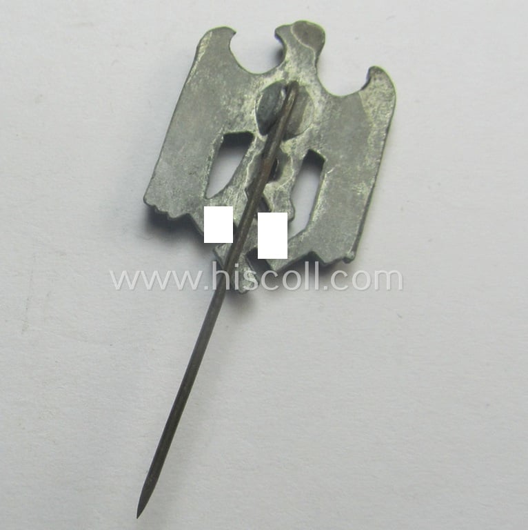 Greyish-silver-toned- (and: 'Feinzink'-based) WH (Heeres) so-called: 'Zivilabzeichen' (or: army civil-attire badge) being a detailed (albeit non-maker-marked) example that comes mounted onto its longer-sized pin