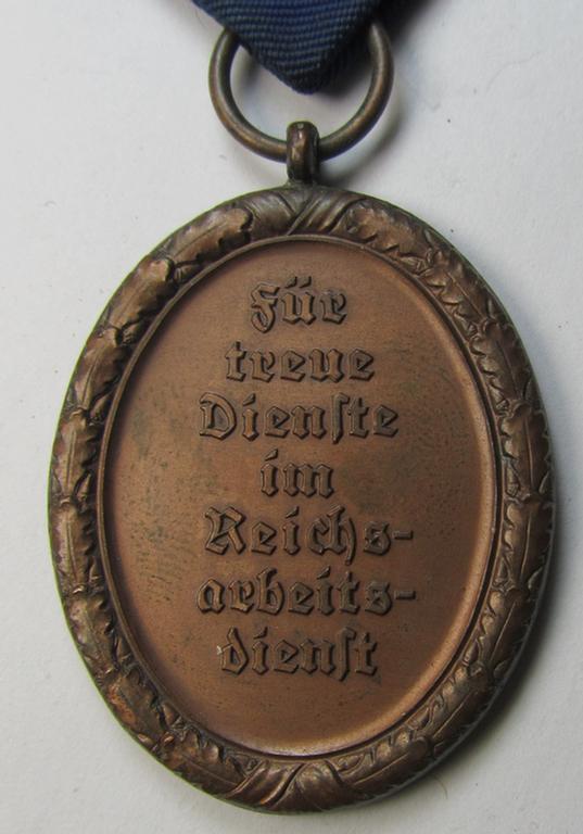 Attractive example of a: RAD (ie. 'Reichsarbeitsdienst') so-called: 'Dienstauszeichnung 4. Stufe für Männer' as was intended for 4 years loyal-service and that comes mounted onto its period piece of ribbon (ie. 'Bandabschnitt')