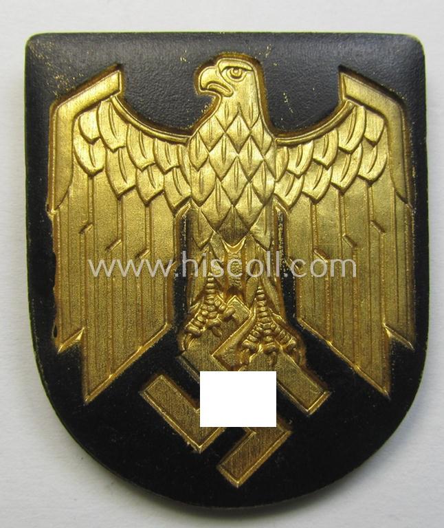 Superb, WH (KM) tropical- (ie. 'DAK'- or: 'Deutsches Afrikakorps'-) related- and/or zinc-based, eagle-'pith-helmet'-shield being a maker- (ie. 'G.B.-41'-) marked example that comes in a very nice- (ie. 'virtually mint- ie. unissued'-), cond...