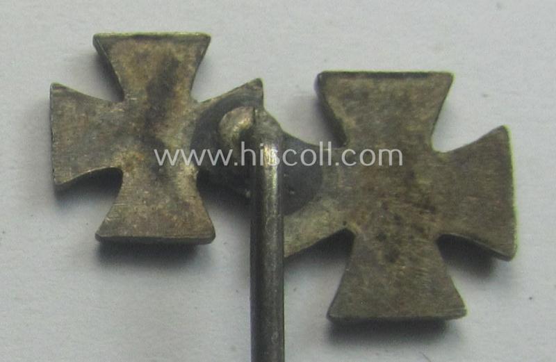 Detailed, 9-mm.-sized 'award'-lapel-pin' depicting respectively an 'EK I. Klasse' and a: 'EK II. Klasse' (being an unmarked and unusually enamelled example)