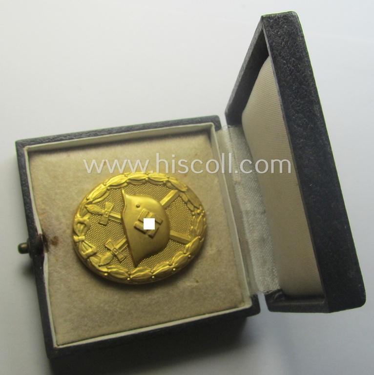 'Verwundeten-Abzeichen in Gold' being a maker- (ie. '30'-) marked- and typical 'Buntmetall'-based example that comes stored in period etui as issued