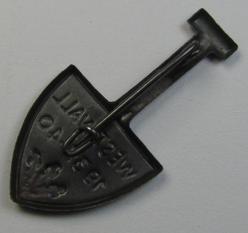 Neat, silver-toned, commemorative- and typical zinc- (ie. tin-) based day-badge (ie. 'tinnie') that comes in the format of a spade and depicting the text: 'Westwall 1939-40'