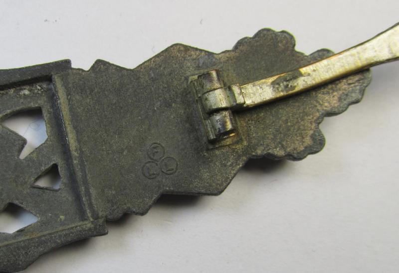 'Nahkampfspange in Silber' (or: silver-class close-combat clasp ie. CCC) being a maker- (ie. 'FLL'-) marked- and/or minimally converse-shaped so-called: '2nd pattern'-specimen as was produced by the maker- (ie. 'Hersteller') 'Friedrich Linde...