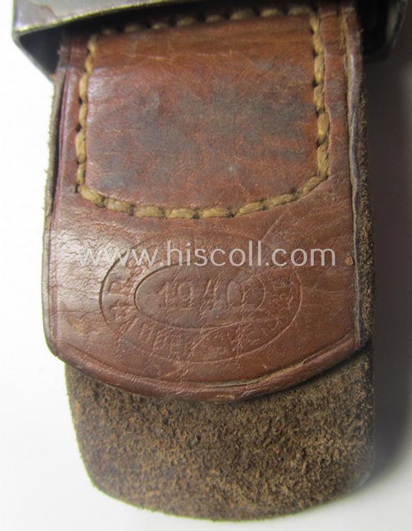 WH (Heeres) field-grey-toned- and steel-based belt-buckle being a maker- (ie. 'R.S.&S.'-) marked example that comes mounted onto its 'R. Sieper u. Söhne'-marked and/or '1940'-dated tab