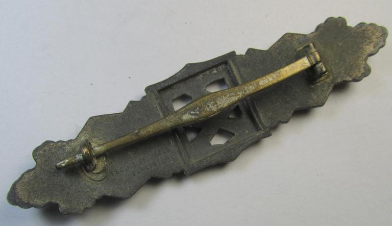 'Nahkampfspange in Silber' (or: silver-class close-combat clasp ie. CCC) being a maker- (ie. 'FLL'-) marked- and/or minimally converse-shaped so-called: '2nd pattern'-specimen as was produced by the maker- (ie. 'Hersteller') 'Friedrich Linde...