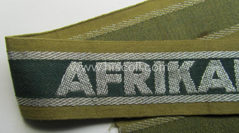 Superb, 'BeVo'-like cuff-title (ie. 'Ärmelstreifen') entitled: 'Afrikakorps' being a presumably issued but never worn example that comes in an overall very nice- (ie. non-shortened- and never tunic-attached-), condition