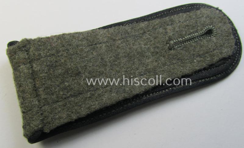 Single, later-war-period so-called: 'M44'-pattern, simplified WH (Heeres) NCO-type shoulderstrap as piped in the black-coloured branchcolour as was intended for usage by a: 'Feldwebel eines Pionier-Abteilungs'