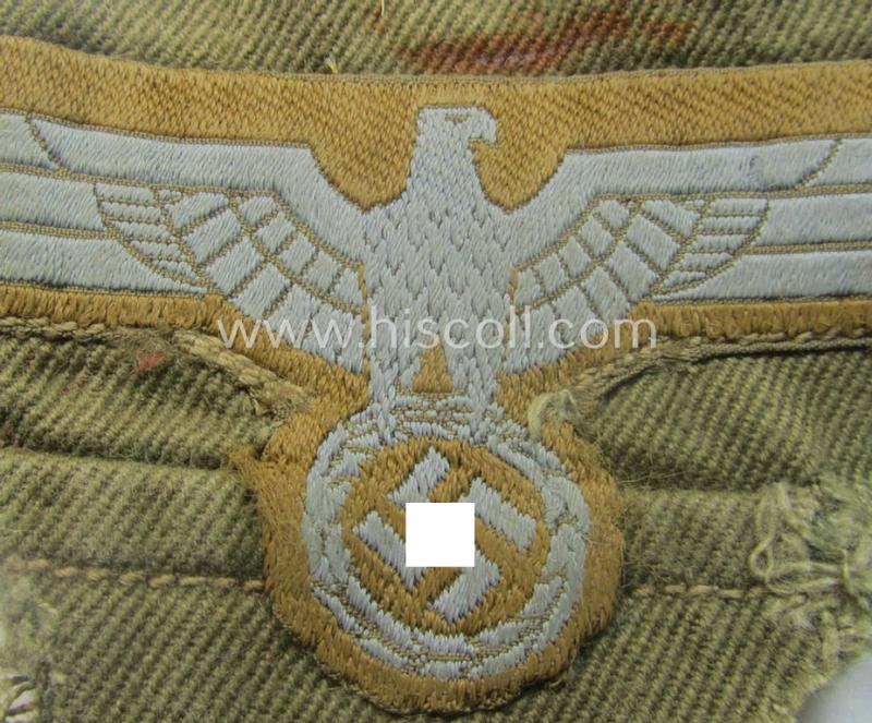 'Cut-out of a tropical-tunic', WH (Heeres) 'tropical-issued', EM- (ie. NCO-) type breasteagle (ie. 'Tropen-Brustadler für Mannschaften und Unteroffiziere des Heeres') that comes in a clearly used- (ie. carefully pre-confectioned-), condition