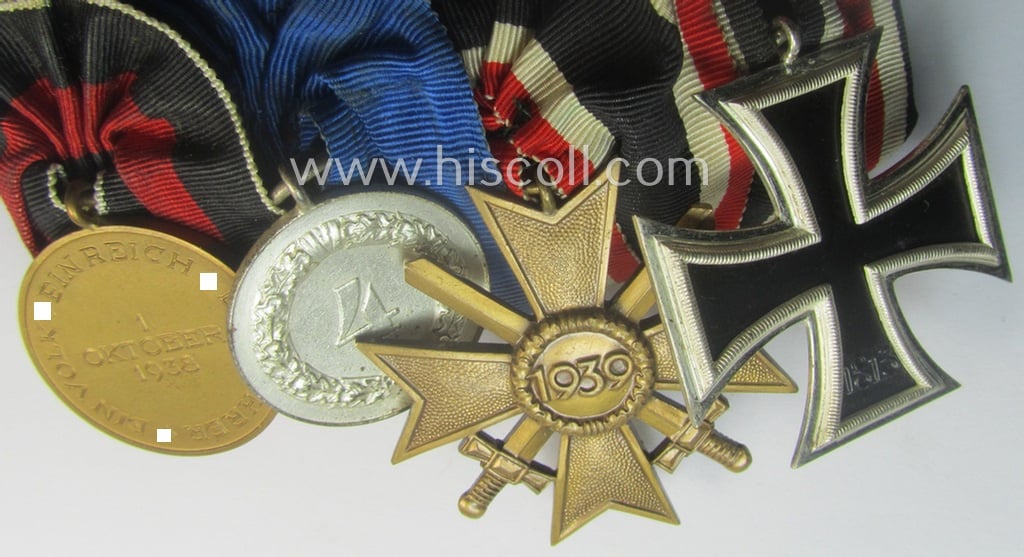 Superb, 4-pieced WH (LW) medal-bar (ie. 'Ordenspange')showing an: 'EK II.Kl.' (in the 'Schinkel'-pattern!), a: 'KvK II.Kl. mit Schw.', a: WH (LW) so-called: 'DA für 4 Jahre t. Dienste' and a: WH Czech 'Anschluss'-medal: '1. Oktober 1938'