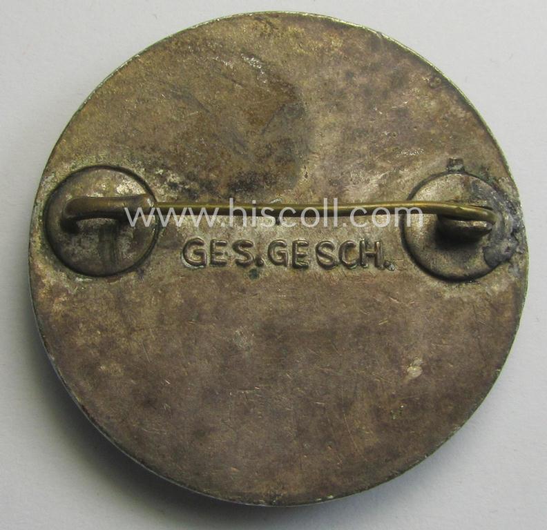 DRK (ie. 'Deutsches Rotes Kreuz' or German Red Cross) nurses'-helpers-badge entitled: 'Schwesternhelferin' (being an example that shows a: 'Ges.Gesch.'-patent-pending (and '1'-) marking on its back