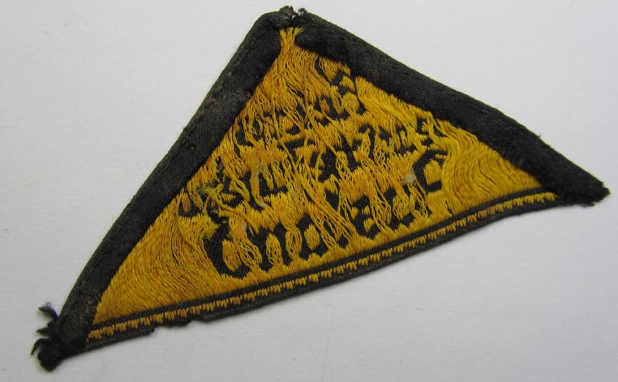 Superb - and extremely rarely encountered! - 'HJ' ('Hitlerjugend') district-triangle (ie. 'Gebietsdreieck') entitled: 'Reichs-deutsche Jugend Ausland' (being a truly worn- ie. used specimen that misses its 'RzM'-etiket)