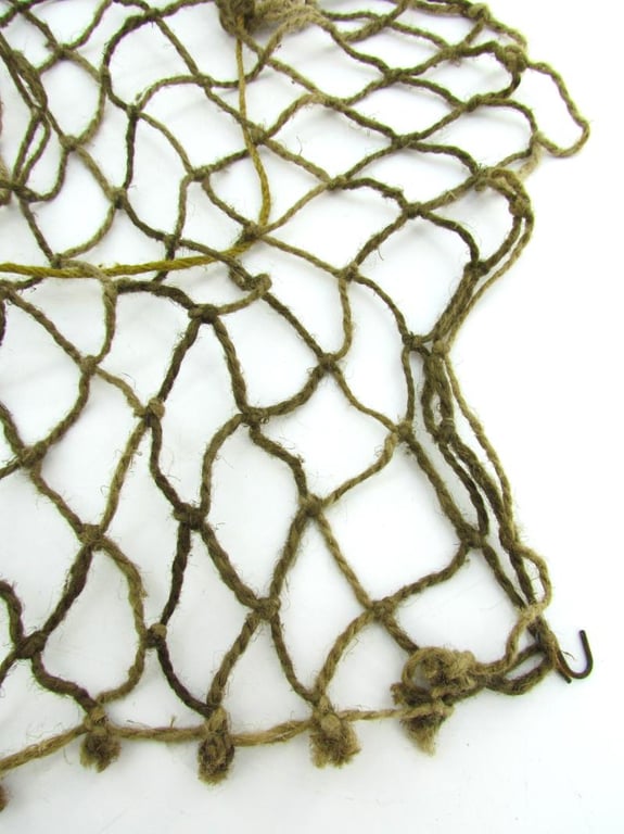 Complete late war German helmet net with attachment hooks