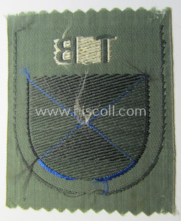 Eastern- ie. Russian volunteer (ie. Cossack-) related armshield as executed in the neat 'BeVo'-weave pattern depicting the interwoven 'Cyrillic' characters: 'TB' (as was intended for the Russian volunteers serving within the 'Terek Cossacks')