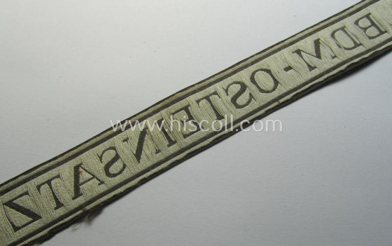Superb - and rarely encountered! - example of the HJ/BDM- ('Hitlerjugend' ie. 'Bund Deutscher Mädel'-) cuff-title (ie. 'Ärmelstreifen') entitled: 'BDM-Osteinsatz' being an example as executed in the neat 'BeVo'-weave pattern