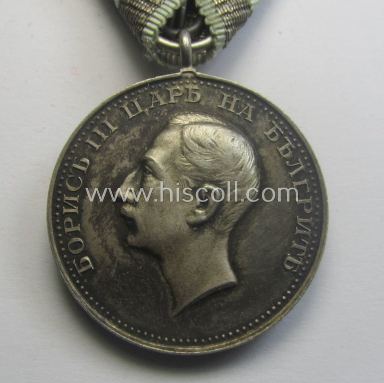 Silver-toned, Bulgarian (pre) WWII-period, military-medal: 'For Merit' (or: in Bulgarian- ie. Cyrilic language: 'Za Zaluga') showing the portrait of King Boris III