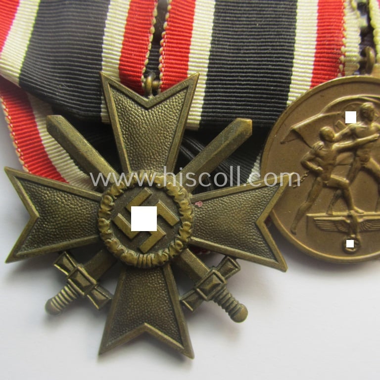Superb example of a 2-pieced medal-bar (ie.: 'Orden- o. Doppelspange') resp. showing a: 'KvK 2. Klasse mit Schw.' and a WH Memelland 'Anschluss'-medal: '22 März 1939' (being of the so-called: 'slanted G'-type)