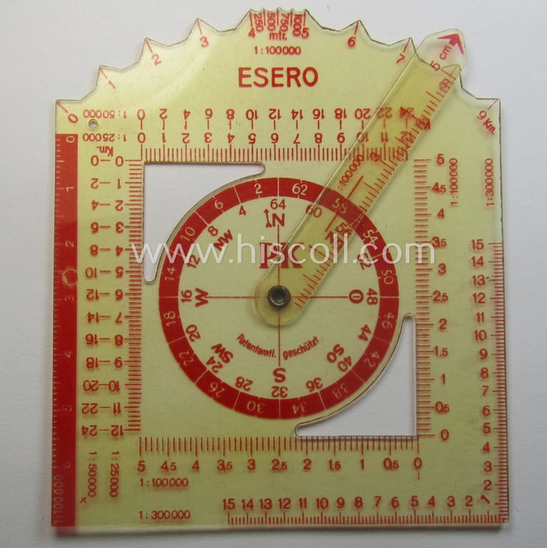 WH-era 'Planzeiger für Wehr- und Geländedienst' (as executed in 'Mica') that comes stored in its period, beige-coloured, paper-based- (and/or maker- ie. 'Esero'- marked-) pouch as issued