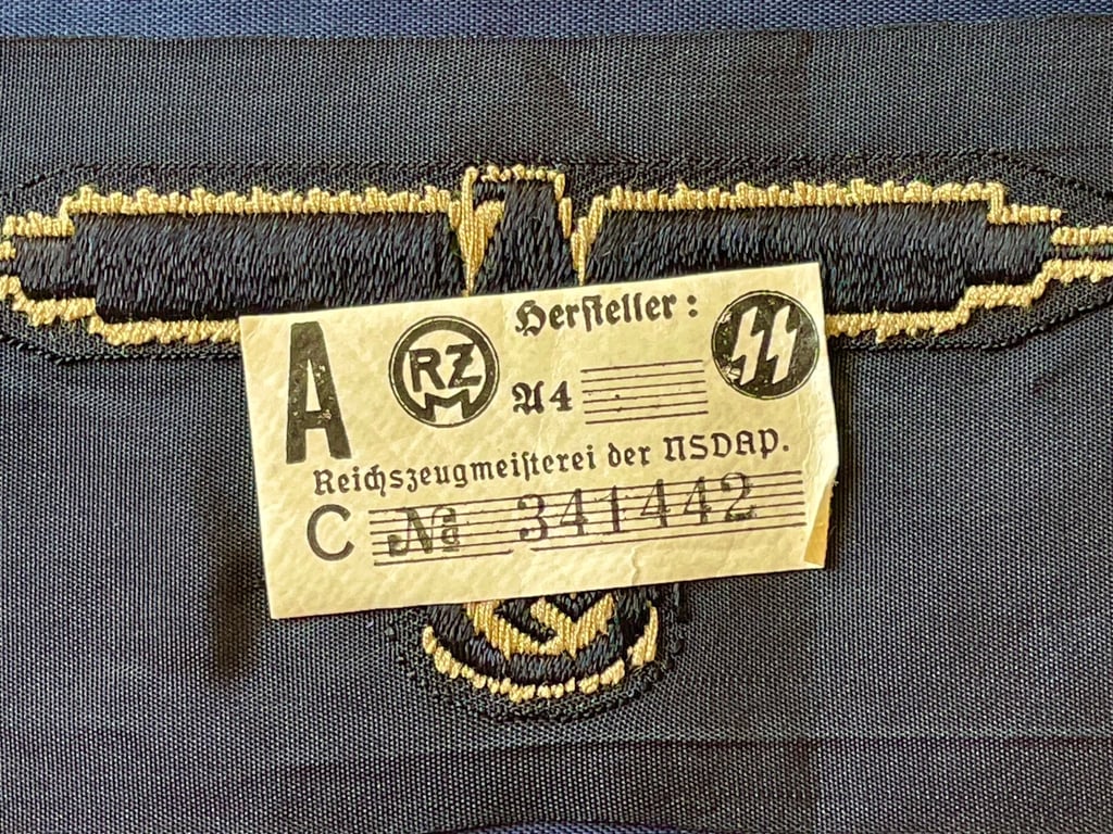WWII GERMAN WAFFEN SS ARM EAGLE WITH SS PAPER ISSUED RZM TAG REMAINING.
