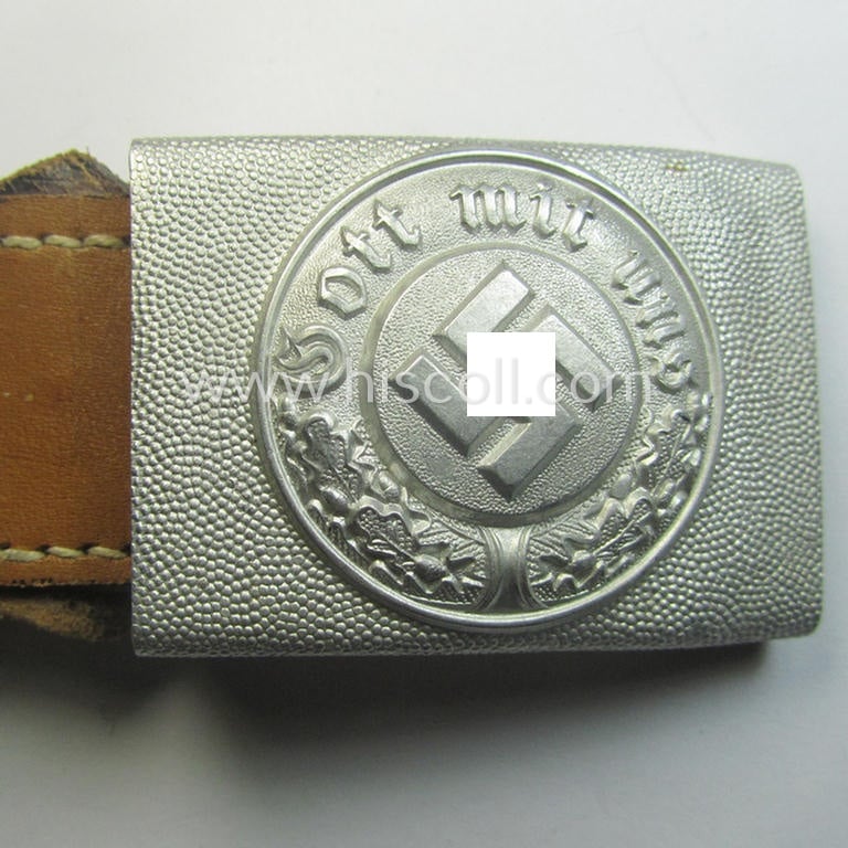 Police (ie. 'Polizei') aluminium-based belt-buckle (ie. 'Koppelschloss für Mannschaften u. Uffz. der Polizei') being a maker- (ie. 'F.L.L.'-) marked and/or: '1942'-dated example that comes in a fully untouched, condition