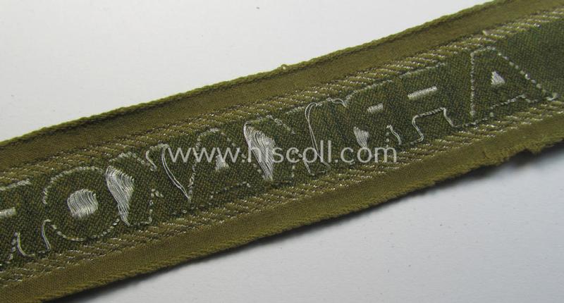 Attractive, 'BeVo'-like cuff-title (ie. 'Ärmelstreifen') entitled: 'Afrikakorps' being a with certainty issued and truly worn example that comes in an overall nice- (ie. minimally shortened-  and/or once tunic-attached-), condition