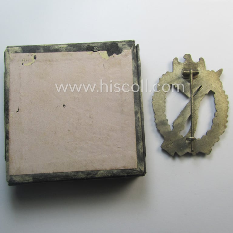 Attractive, 'Infanterie Sturmabzeichen in Silber' (or: silver-class infantry assault-badge ie. IAB) being a maker- (ie. 'ÜÜ'- ie. 'E.F. Wiedmann') marked so-called: 'Lily Pad-hinge'-example that comes stored in its period box