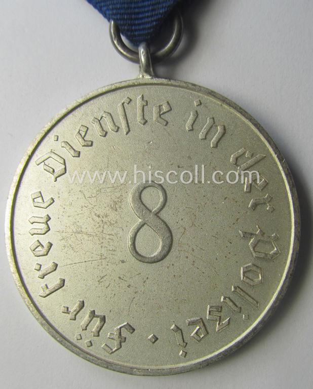 Bright-silver-toned so-called: 'Polizei-Dienstauszeichnung 3. Stufe' (or: police loyal-service medal 3rd class) that comes mounted onto its period ribbon (ie. 'Bandabschnitt')