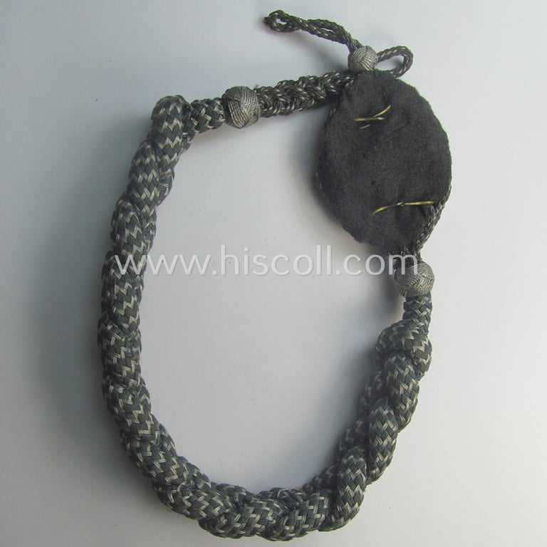WH (Luftwaffe) 'Schützenschnur' (ie. shooting-lanyard) being an example of the lowest- (ie. third) grade (ie. 'Luftwaffe Schützenschnur der 3. Stufe für Gewehrschutzen')