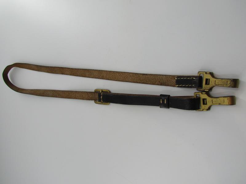Leather shoulder strap marked DRGM