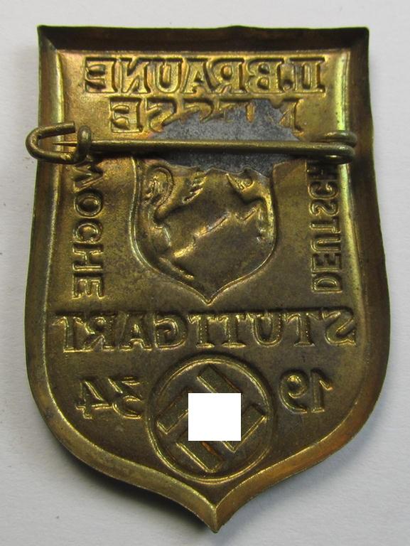 Early-period, golden-bronze-coloured- and/or tin-based, N.S.D.A.P.-related day-badge (ie. 'tinnie' or: 'Veranstaltungsabzeichen') being a commemorative example that is entitled: 'II. Braune Messe -  Deutsche Woche - Stuttgart - 1934'