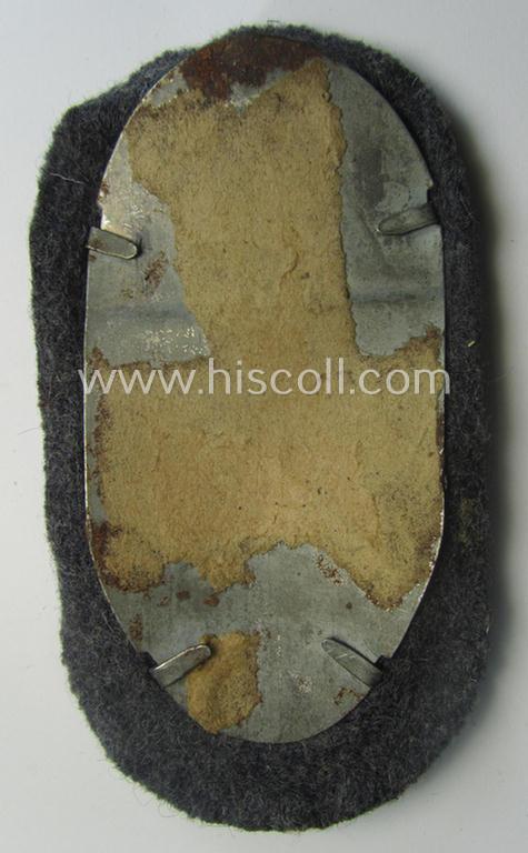 WH (Luftwaffe) 'Demjansk'-campaign-shield as executed in typical magnetic metal (ie. so-called: 'Eisenblech') and that comes in an overall nice- (ie. most certainly worn but nevertheless ie. fully untouched!), condition