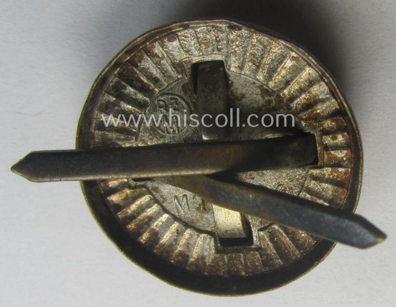 Political-style- (ie. N.S.D.A.P.-related-) multi-pieced visor- (ie. 'Schirmmützen'-) cap-cocarde which is neatly: 'RzM' and/or 'M1/34' marked on its back