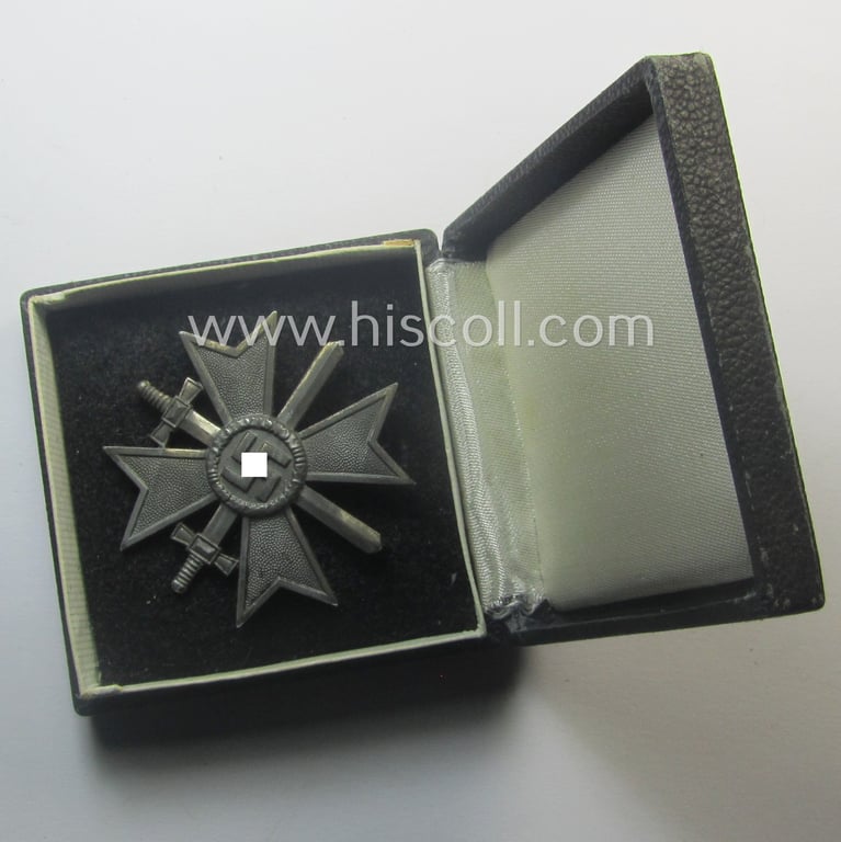 'Kriegsverdienstkreuz 1. Klasse mit Schw.' being a maker- (ie. '3'-) marked (and/or 'Feinzink'-based) specimen by the maker: (ie. 'Hersteller') 'Wilh. Deumer' that comes stored in its original, simplified 'KvK'-etui