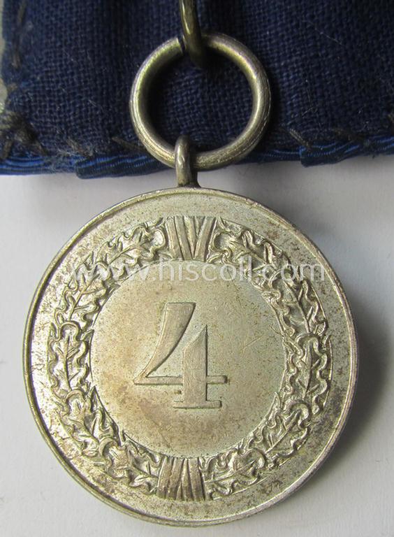 Attractive, bright silver-toned WH (Luftwaffe) so-called: 'Einzelspange' showing a: 'WH-Dienstauszeichnung 4. Stufe' (as was intended for 4 years of loyal-service) and that shows a detailed, Luftwaffe-type-eagle-device, period-attached