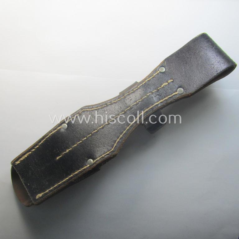 Genuine-leather-based- and/or black-coloured, 'standard-pattern' (and I deem later-war-period) WH (Heeres, Waffen-SS, Luftwaffe etc.) so-called: K98 bayonet-frog (ie. 'Tragetasche o. Koppelschuh') being a maker-marked (ie. 'RbN.'-numbered) exam...