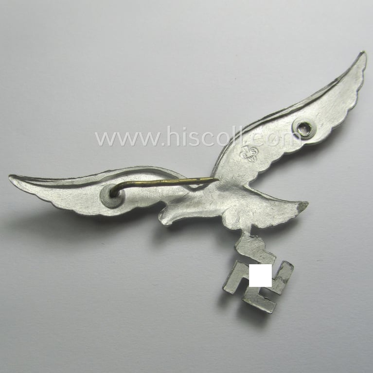 Minimally worn, WH (Luftwaffe) EM/NCO-pattern visor- (ie. 'Schirmmützen'-) cap-eagle being a maker- (ie. 'BSW'-) marked example as executed in aluminium based metal