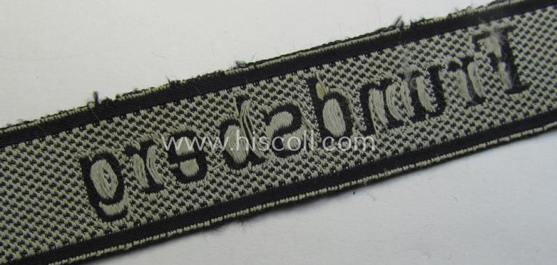 Stunning - and truly worn! - Waffen-SS 1943/44 pattern cuff-title (ie. 'Ärmelstreifen') depicting the machine-woven Latin script text in silver-grey-coloured linnen as was  intended for a member within the: 10. SS-Panzer-Division 'Frundsberg'