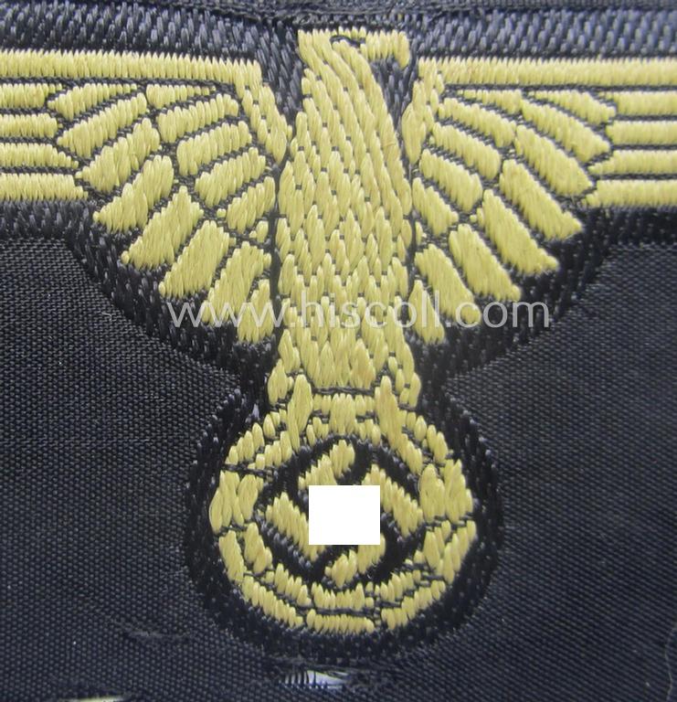 Partly damaged, 'SS' (ie. 'Waffen-SS') 'BeVo'-woven, EM- (ie. NCO-pattern) tropical-styled arm-eagle (ie. 'Tropen-Ärmeladler für Mannschaften u. Unterführer der Waffen-SS')